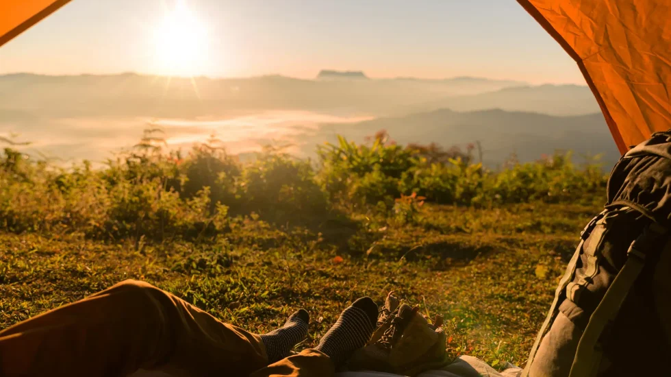 hiker-man-sitting-tourist-tent-by-travel-discovery-concept