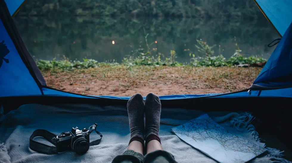 people-camping-by-river